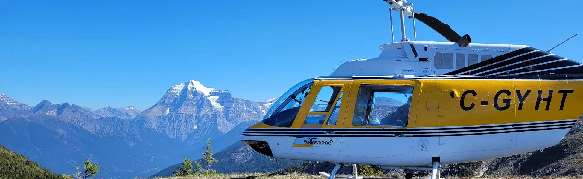 A Yellowhead Helicocpters Bell 206 landed on top of Mt Terry Fox near Mount Robson Park