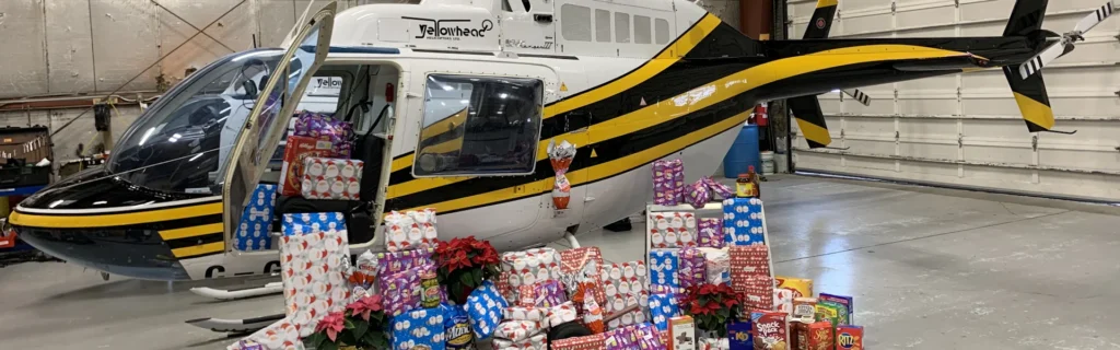Employees Adopt-A-Family Xmas 2019 4 Photo of YHL Bell 206 surrounded by Christmas gifts and food
