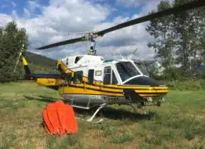 Bell 212 with wildfire fighting equipment bambi bucket