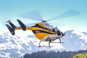 BK117 helicopter filmed working with powerline transmission crews in northwestern BC
