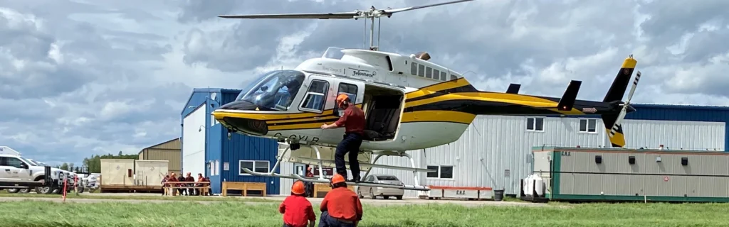 Photo of BC Wildfire hover exit training with Bell 206 helicopter