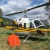 Bell 212 helicopter with bambi bucket ready for wildfire suppression